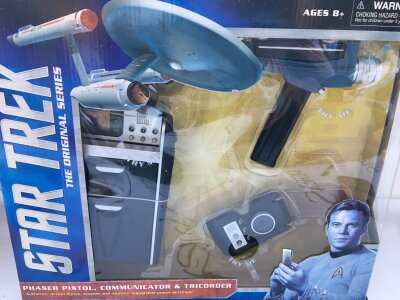 A Boxed Dimond Select Toys Star Trek Phaser Pistol, Communicator and Tricorder.