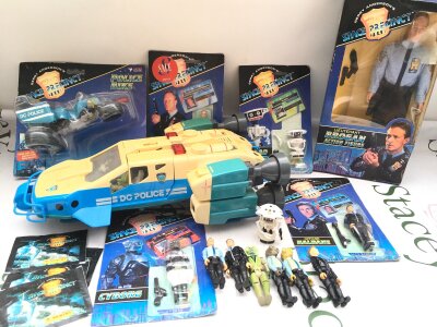 A Collection of Carded And Loose Space Precinct Toys. Including Panini Stickers.