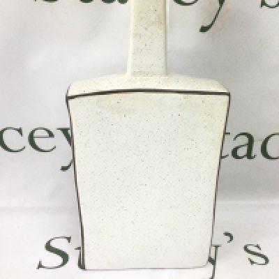 An unusual Troika vase of extended chimney shape in a subdued mottled finish, approx height 32.5cm. Shipping category D.