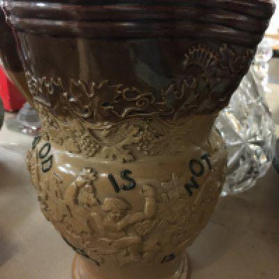 A Doulton motto jug with raised figures. NO RESERVE