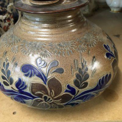 A large Doulton style stoneware jug decorated with flowers and foliage. NO RESERVE