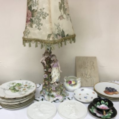 A porcelain lamp surmounted with figures (damaged) two Royal Copenhagen porcelain plaques decorative plates and other ceramics. NO RESERVE