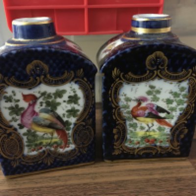 A pair of Worcester style porcelain caddies decorated with birds flowers and foliage. NO RSESERVE