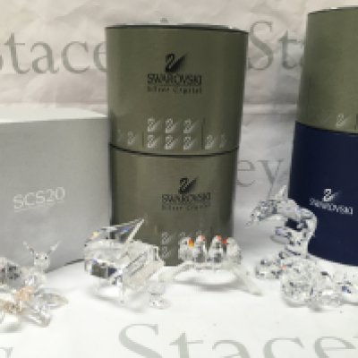 Boxed Swarovski figures including a Dolphin, rose, Bee, Lovebirds, Piano. Postage category C