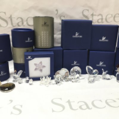 A collection of boxed Swarovski crystal glass figures including butterfly, vase of roses, rabbit, owl, heart etc. postage category C
