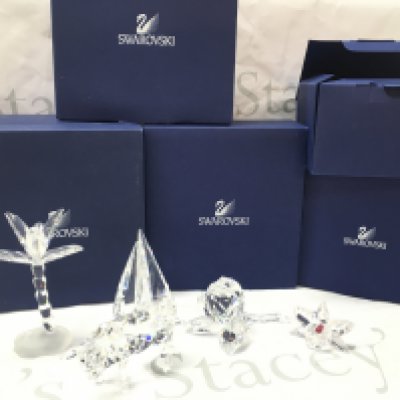 Boxed Swarovski crystal glass figures including a cow, palm tree, rose etc. postage catC