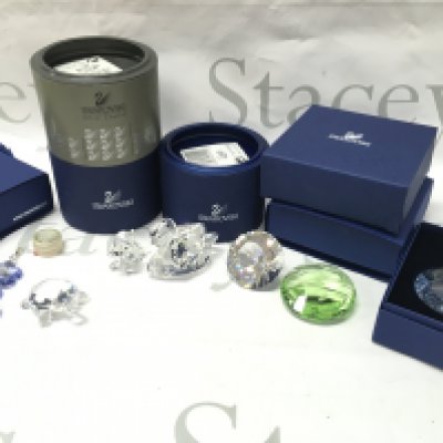 A collection of Swarovski crystal glass figures and ornaments including turtle, swan, dog etc