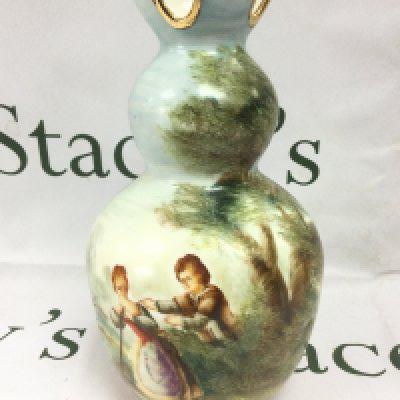 A 19th Century vase with hand painted decoration of figures in a countryside setting, approx height 26.5cm. Shipping category D.