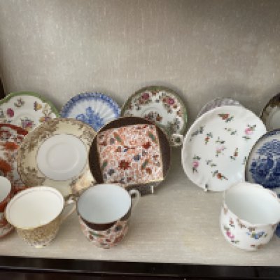 A collection of various teacups and saucers. Shipping category D.