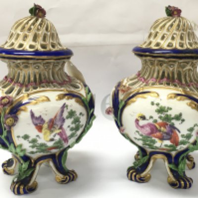 A pair of small 19th century pot porri vases in the style of Vincennes with hand painted mythical bird decoration. Some restoration. Marked H at base. This lot cannot be posted