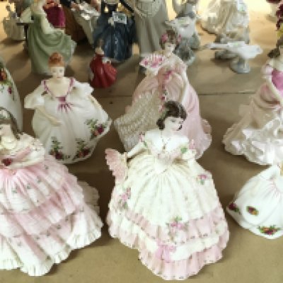 A collection of porcelain figures including Royal Doulton and Coalport. This lot cannot be posted