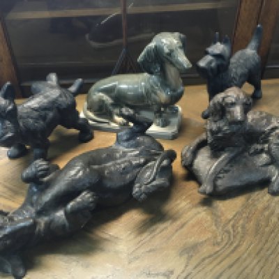 A collection of dog figures including a ceramic Dash Hound, simulated bronze Dash Hound etc. this lot cannot be posted