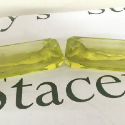 A pair of Uranium Art Deco glass dishes of rectangular shape moulded with a raised nude figure. Length 11.5cm
