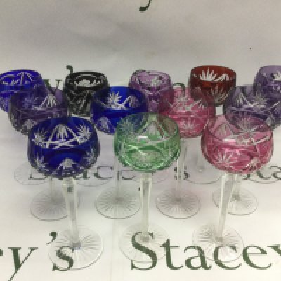 Nine Bohemian cut crystal hock glasses and three others. Shipping category D.