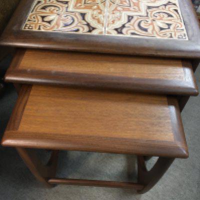 A nest G plane tables one inset with tiles.