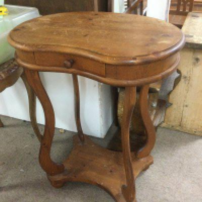 A kidney shaped pine side table fitted with a single drawer, approx height 69.5cm. Shipping category D.