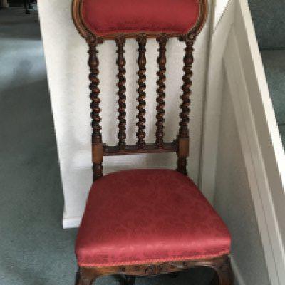 A Victorian carved walnut occasional chair the arched top rail above spirally turnings and conforming uprights.with an upholstered seat and back. NO RESERVE