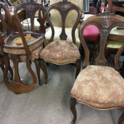 A set of six Victorian carved Irish walnut dinning chairs with shaped and carved backs above upholsterd seats on cabriol legs. (6). NO RESERVE