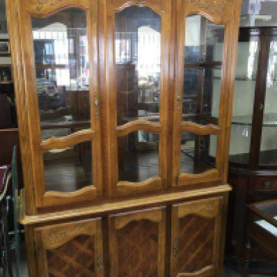 A light wood display cabinet with glazed doors above cupboards with glass shelves 202cm high width 135cm. NO RESERVE