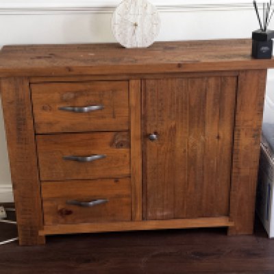A Modern pitch pine sideboard, cabinet. 98cm x 80cm x 35cm together with a matching wall mirror. 110cm x 70cm.