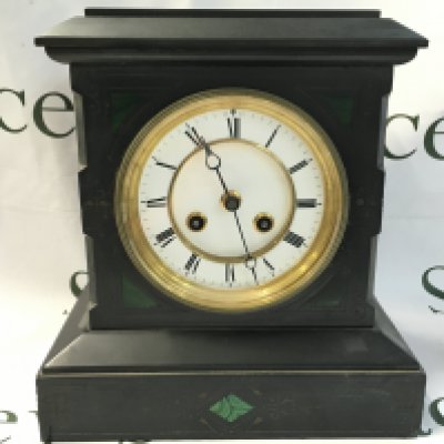 A slate mantle clock with a white enamel Roman numeral face and green stone inlay . Seen working. This lot cannot be posted