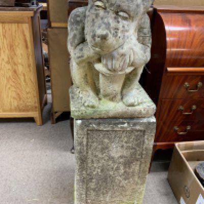 A large cast concrete gargoyle and pedastal. (D)