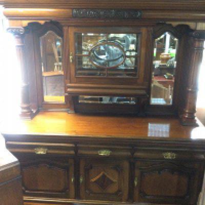 A large Edwardian mirror backed sideboard with Ionic column supports, approx 200cm x 220xm x 66cm. Shipping category D.