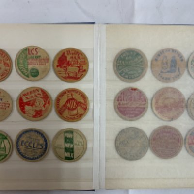 A collection of 68 card milk bottle advertising tops. (B)