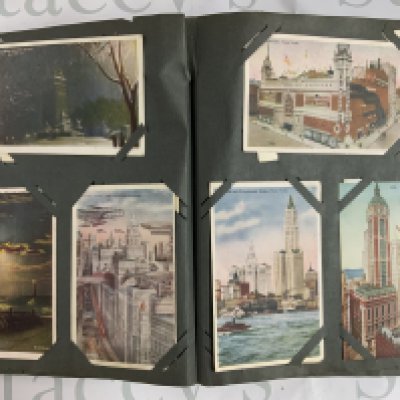 A 1920s postcard album together with a collection of loose postcards. (D)