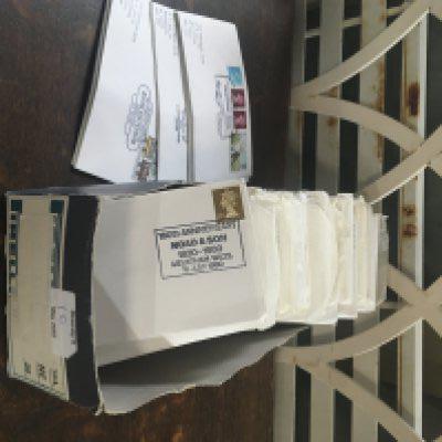 A box of stamps with various post marks. NO RESERVE