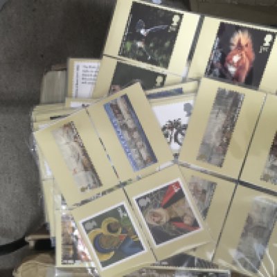 A box containing various royal mails stamp card series including Christmas sences,battle of Trafalgar and science from nature. NO RESERVE