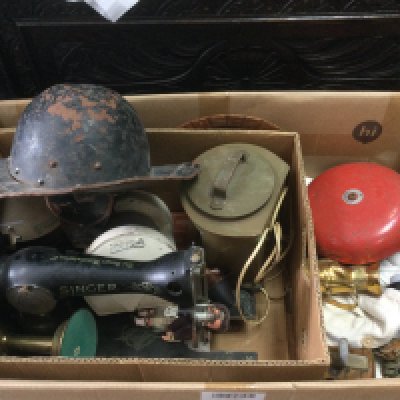 A large box of oddments including a Cromwellian Civil War style helmet, a Singer sewing machine, ship lights etc. Shipping category D