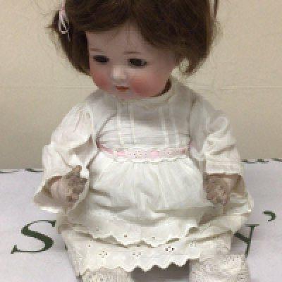 A small bisque headed doll with composition body the head marked Germany. NO RESERVE
