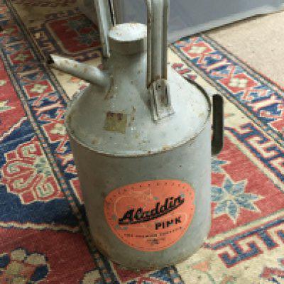 A Pink and Green Aladdin pink paraffin Can , no reserve postage category C