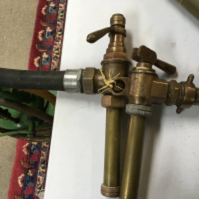 Two heavy brass pumps possibly for petrol. No reserve postage category C
