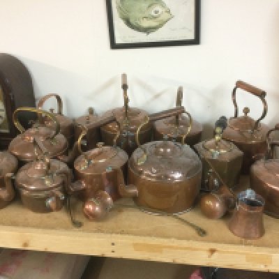 A collection of copper kettles, ladles and a large pan. Shipping category D.