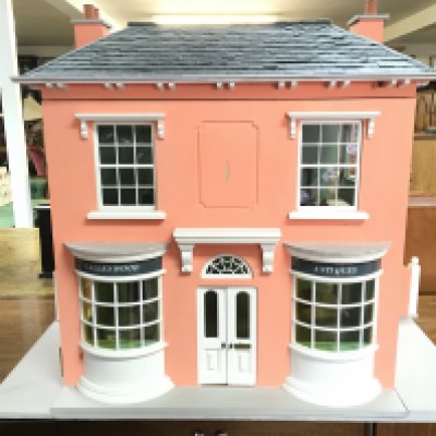 A Sid Cooke Coxwold dolls house with shop On the ground floor Galleywood Antiques with flat above with some furniture Council tax band B. 62cm tall 72cm wide approximately