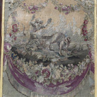 An 18th century framed tapestry of a wolf being chased by a devil dimensions 49x64cm