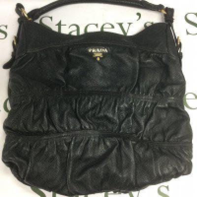 A Prada black leather shoulder bag. Shipping category B.