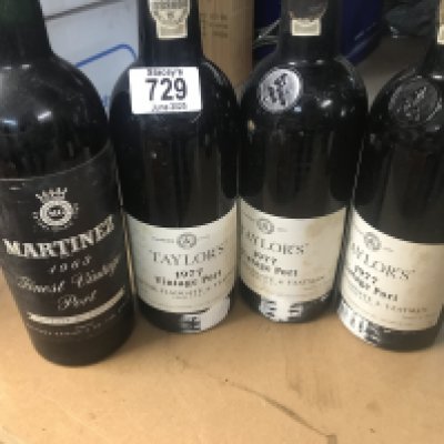 Four bottles of vintage port .