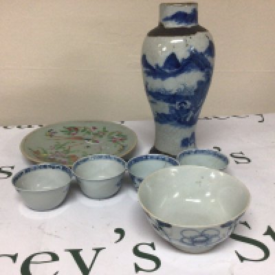 A collection of Chinese export porcelain late 18th century blue and white tea bowls a crackle ware vase celadon plate and other Chinese ceramics. Some damage.