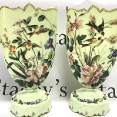 A pair of Victorian glass vases decorated with flowers and birds, 32.5cm tall. This lot cannot be posted