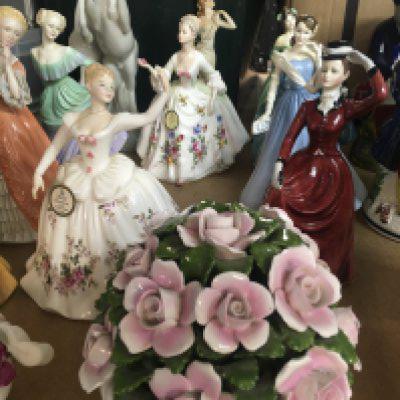 A Collection of Doulton and other figurines including sir Winston Churchill.