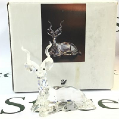 A boxed Swarovski Africa 1994 Kudu Crystal glass figure. Approximately 9.5cm tall. No obvious damage or restoration This lot cannot be posted. NO RESERVE