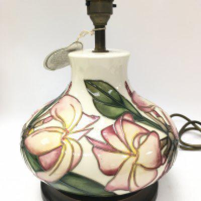 A Moorcroft Frangipani ceramic lamp, this lot cannot be posted. Approximately 28cm tall. NO RESERVE