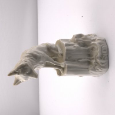 A 20thC Nymphenburg white porcelain figure of fox seated upon a tree stump. 12.5cm. NO RESERVE