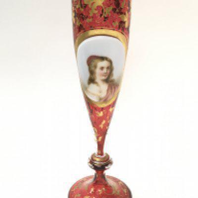 A Victorian Bohemian Cranberry portrait vase with gilt decoration , 22cm tall. This lot cannot be posted