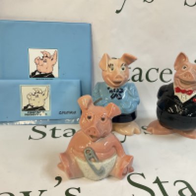 A collection of Wade porcelain pig money banks,