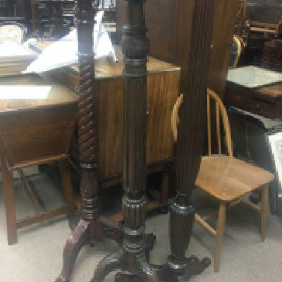 Three mahogany torches the fluted columns on cabriole legs .