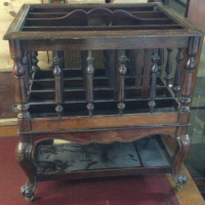 A Victorian rosewood Canterbury with four open sections on cabriole Legs United by an under self. NO RESERVE